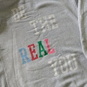 Aerie hoodie sweater with " be the real you" lettering on the back.